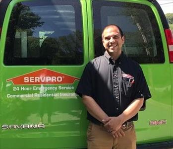Jason - in front of one of our SERVPRO vans 